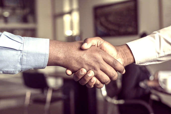 two people shaking hands